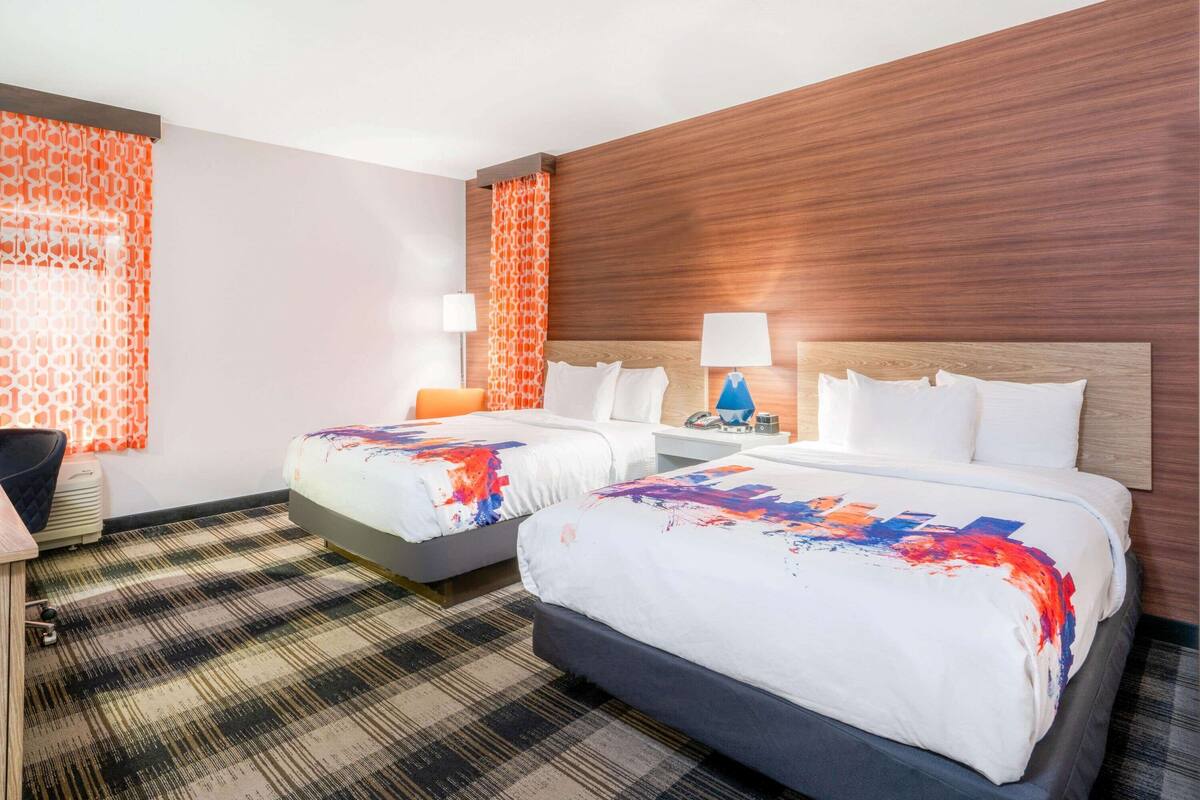 Premium bedding, pillow-top beds, desk, laptop workspace