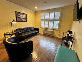 Exclusive Suite | Living area | 43-inch LCD TV with premium channels, TV