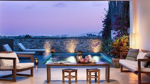 A rooftop terrace with a pool, lounge chairs, and a view of the landscape. - Villa Majica (Jijoca de Jericoacoara)