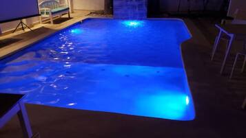A swimming pool with blue lighting.