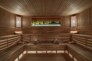 A sauna with wooden benches and a cityscape mural on the wall. - DoubleTree by Hilton Istanbul Topkapi (Istanbul)