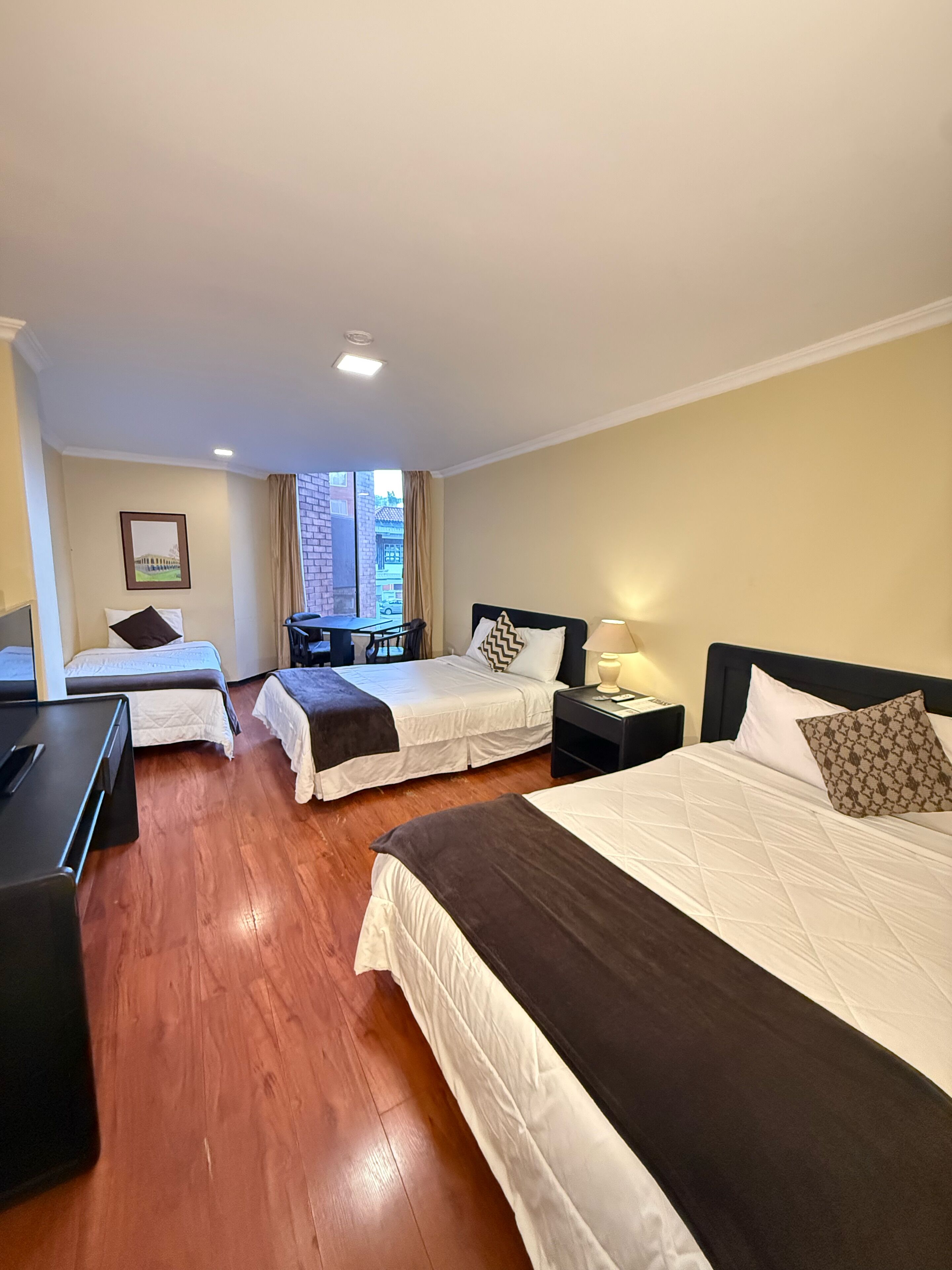 Standard Triple Room, Private Bathroom, Garden Area | Minibar, desk, blackout drapes, soundproofing