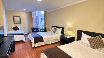 Standard Triple Room, Private Bathroom, Garden Area | Minibar, desk, blackout drapes, soundproofing