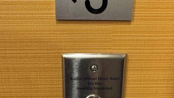 A doorbell with an audio-visual alert for the hearing impaired and a button to depress for 5 seconds.