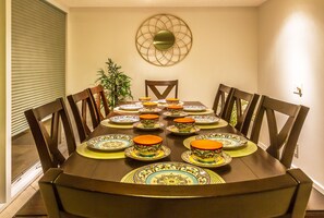 Enjoy meals in this dining area with a round table and eight comfortable chairs.