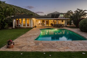 A house with a swimming pool, stone patio, and a covered outdoor dining area. -  PARADISE PROMISED! Spacious 4 bedroom home, 3.5 bathroom, 2 kitchens (Honolulu)