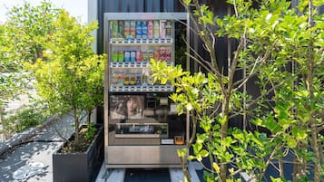A vending machine with various beverages and snacks.