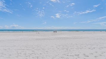On the beach, sun loungers, beach towels
