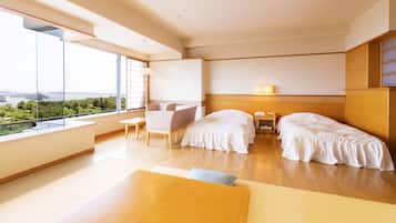 A modern hotel room with a large window, a sofa, two beds, and a wooden floor.