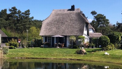 Fantastic 5 ***** Thatched cottage on the water with sauna, outdoor Jacuzzi, fireplace u. v.