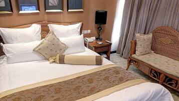 Suite Deluxe | Minibar, escritorio, cortinas blackout y wifi gratis