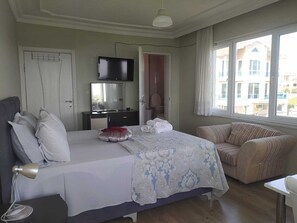 Premium bedding, desk, laptop workspace, free WiFi