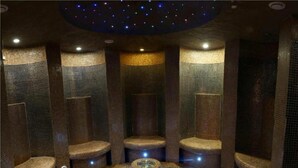 A spa room with a circular seating area and individual massage chairs. - Gino Wellness Rabath Hotel and Spa (Akhaltsikhe)