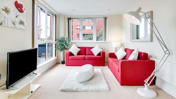 Apartment, 2 Bedrooms | Living room | Flat-screen TV, pay movies