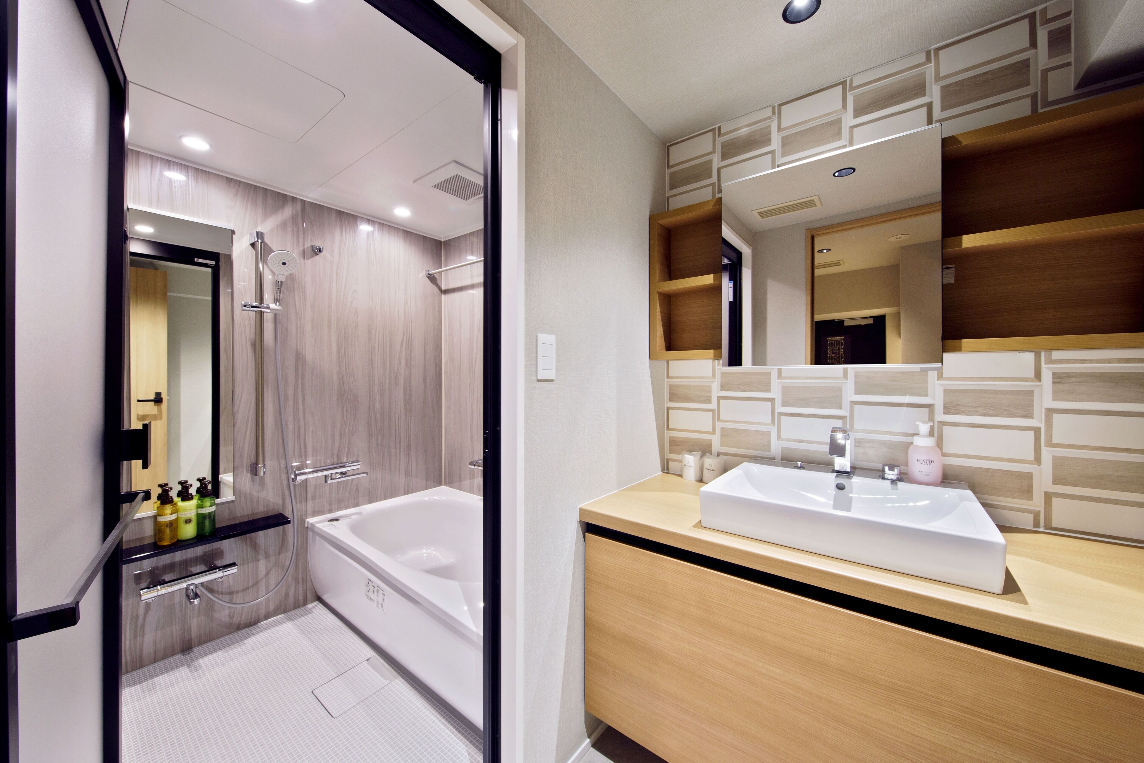 deluxe twin room | bathroom | hair dryer, slippers, electronic bidet, towels