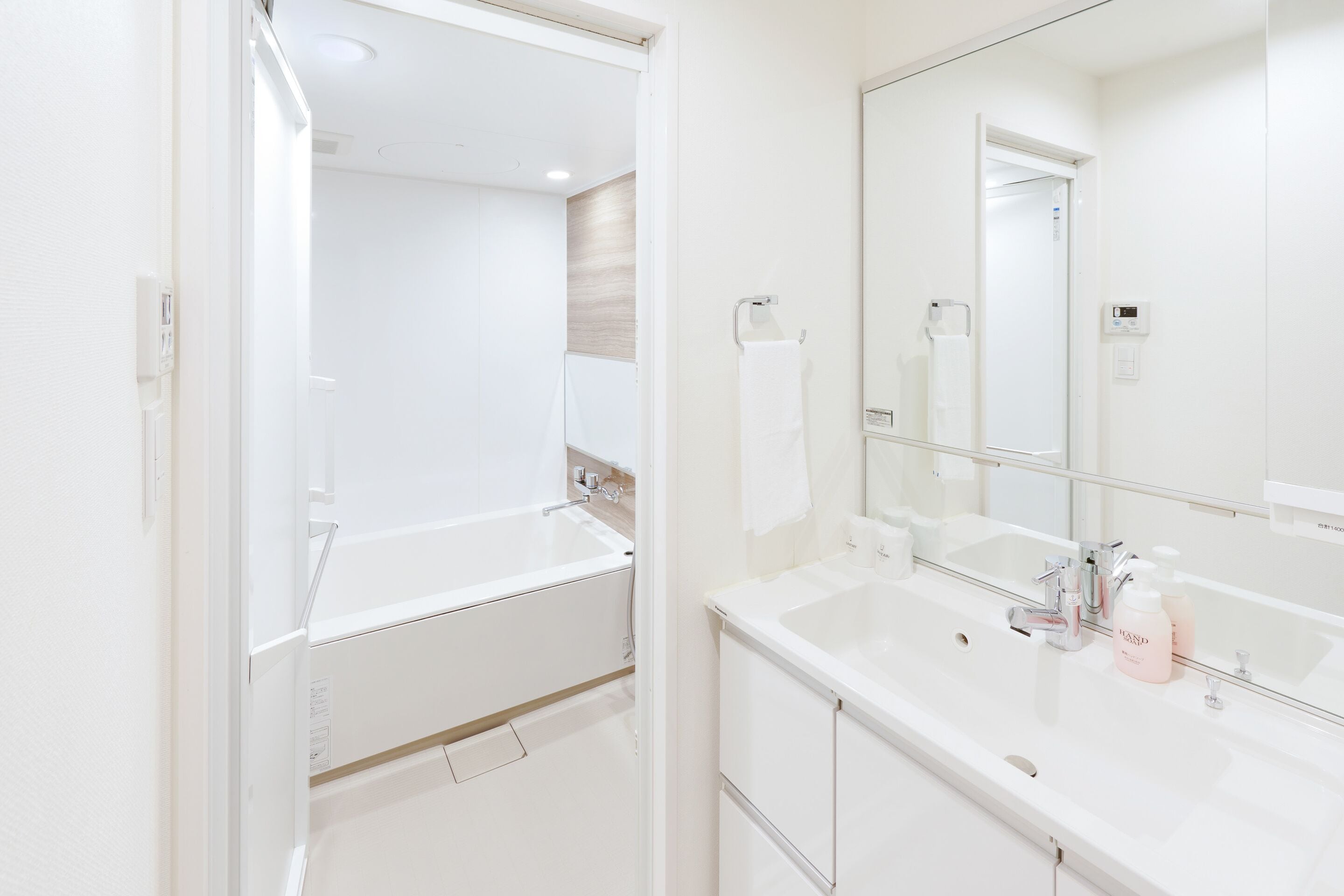 hair dryer, slippers, electronic bidet, towels