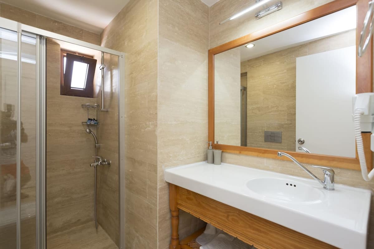 Shower, free toiletries, hair dryer, slippers