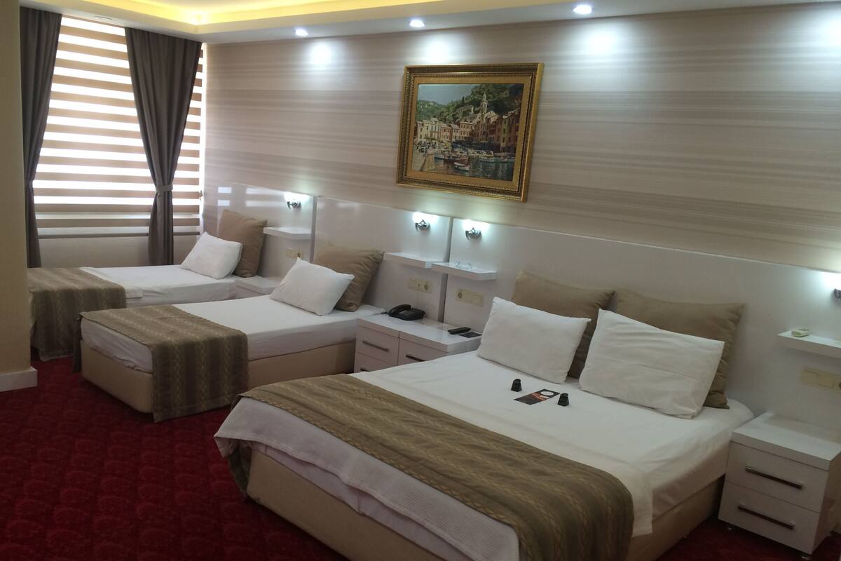Deluxe Quadruple Room | In-room safe, desk, iron/ironing board, rollaway beds