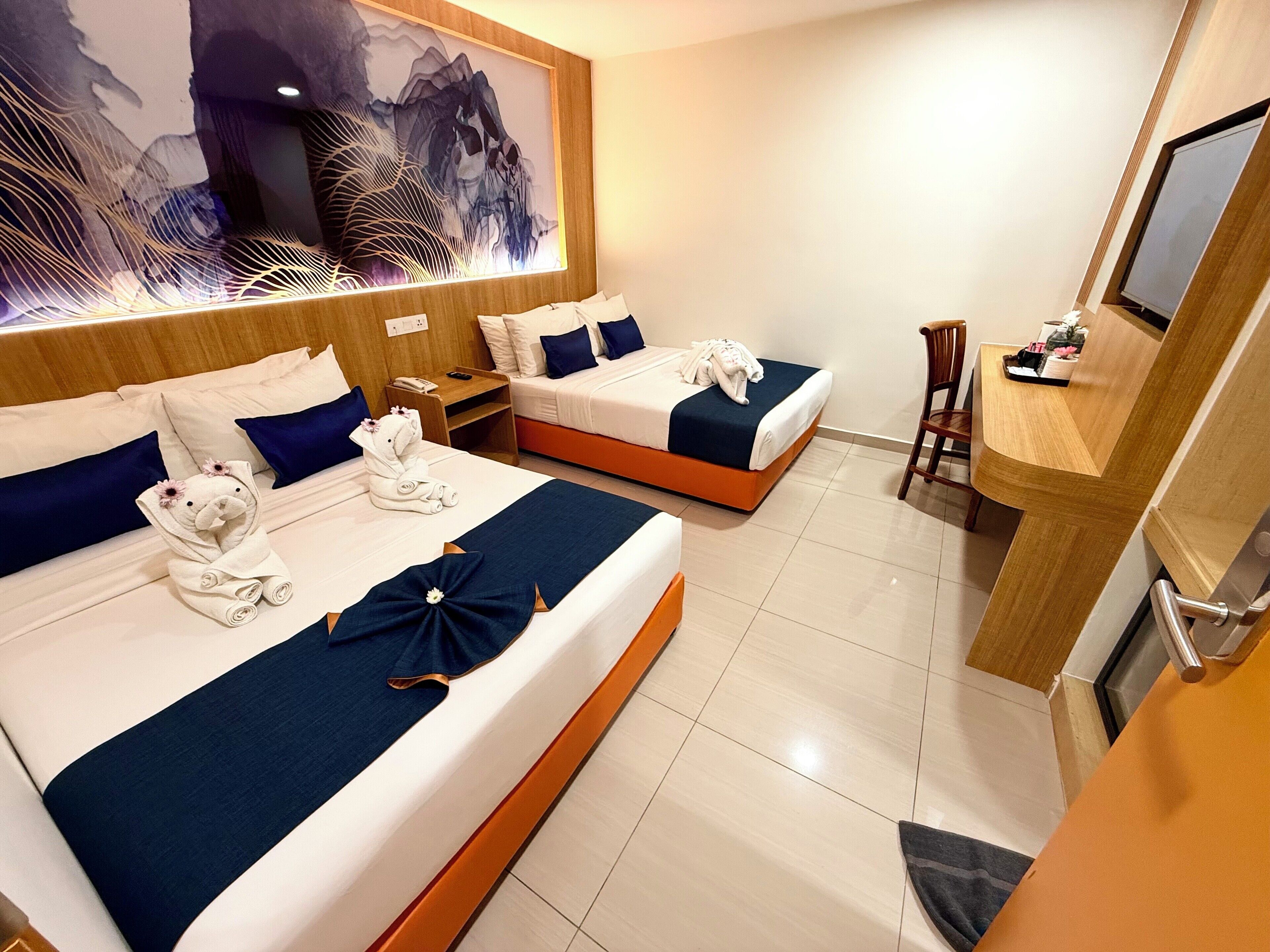Select Comfort beds, minibar, desk, laptop workspace