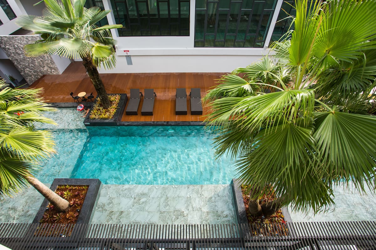 Deluxe Triple Room with Pool View | Minibar, in-room safe, blackout drapes, free WiFi