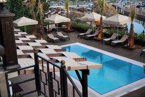 Outdoor pool, pool umbrellas, sun loungers