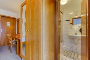 Shower, free toiletries, hair dryer, slippers
