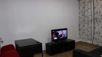 Standard Double Room | Living area | 42-inch LCD TV with cable channels, TV