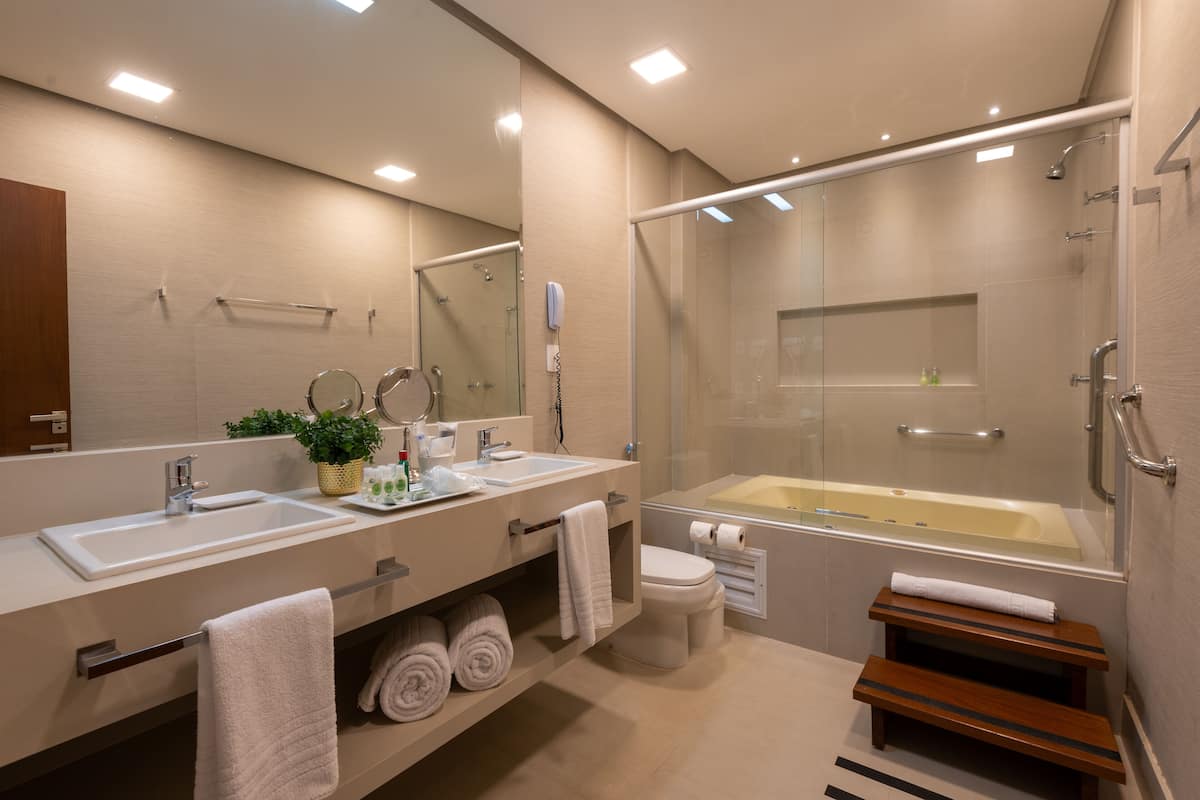 designer toiletries, hair dryer, towels, soap