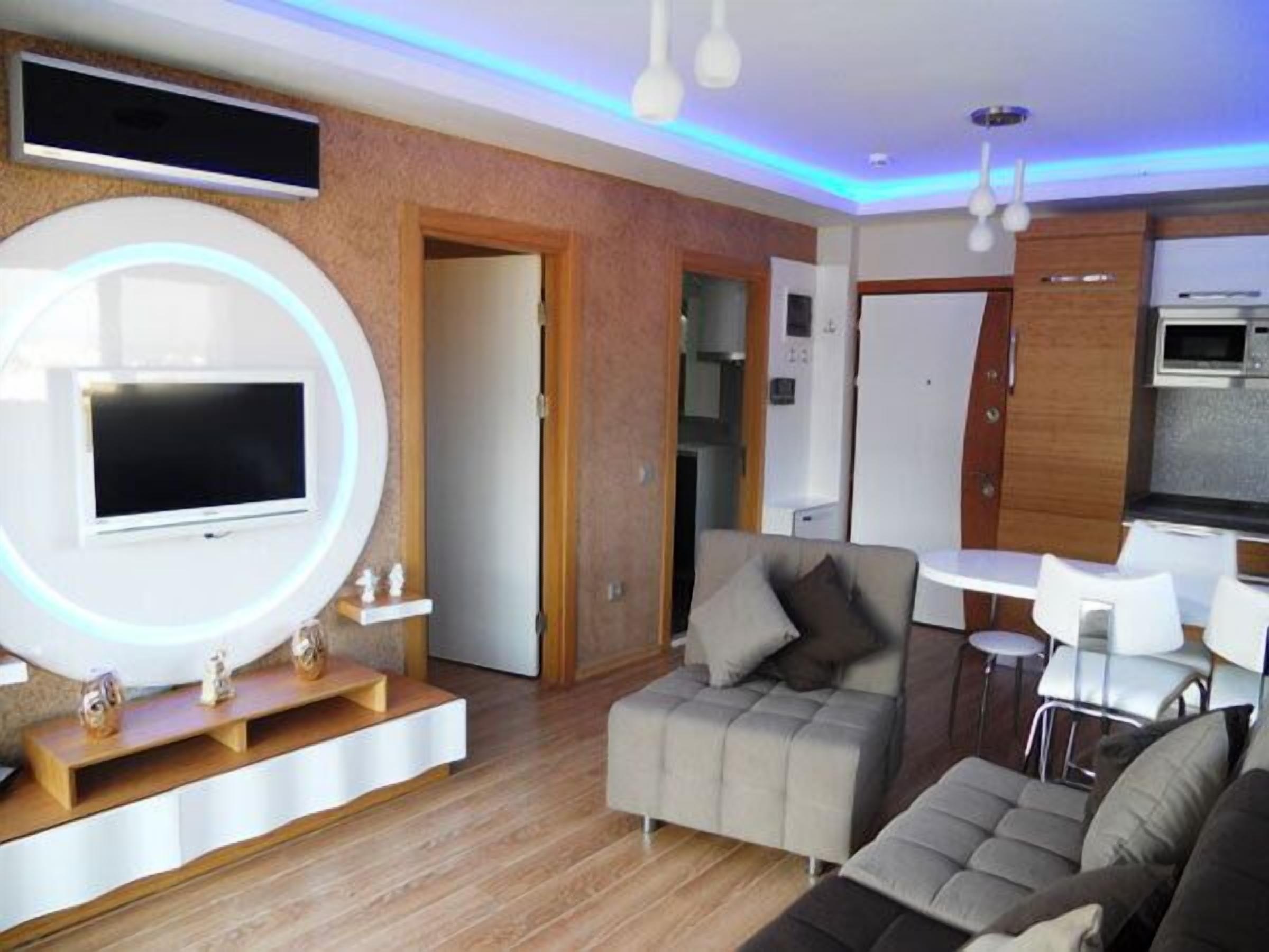 Suite, 2 habitaciones, vista parcial al mar (4 Pax) | Sala de estar | Televisión LCD 