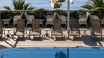 Outdoor pool, pool umbrellas, pool loungers