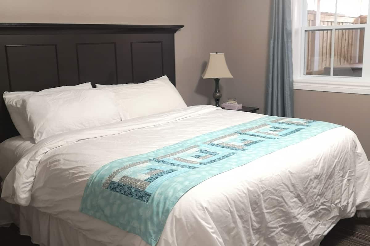 luxury suite, jetted tub | memory-foam beds, desk, blackout curtains, iron/ironing board