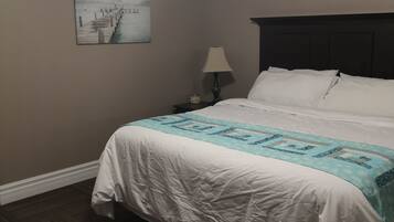 Luxury Suite, Jetted Tub | Memory foam beds, desk, blackout drapes, iron/ironing board