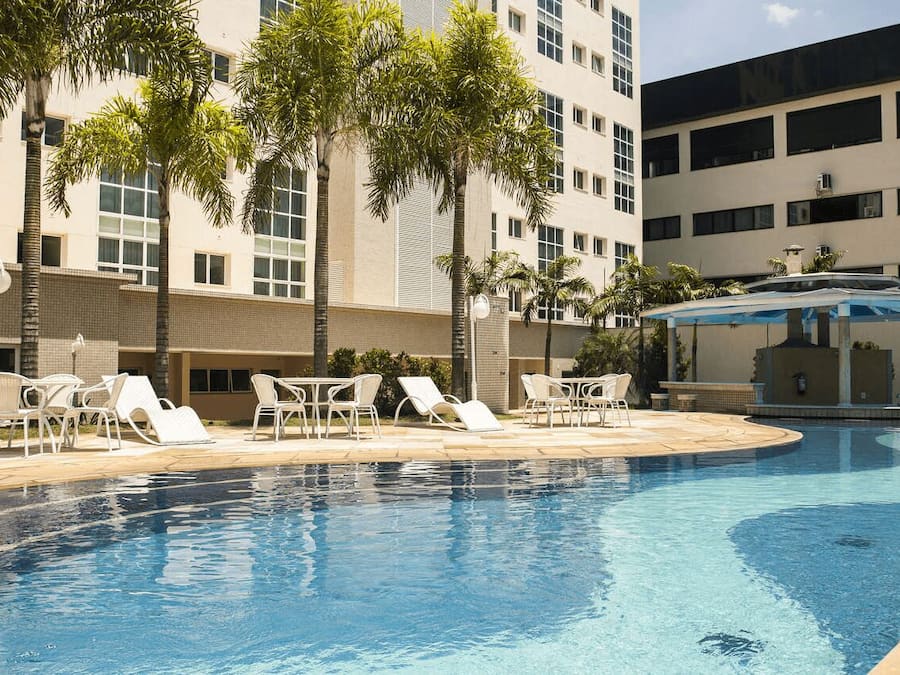 Outdoor pool, open 6:00 AM to 10:00 PM, pool loungers