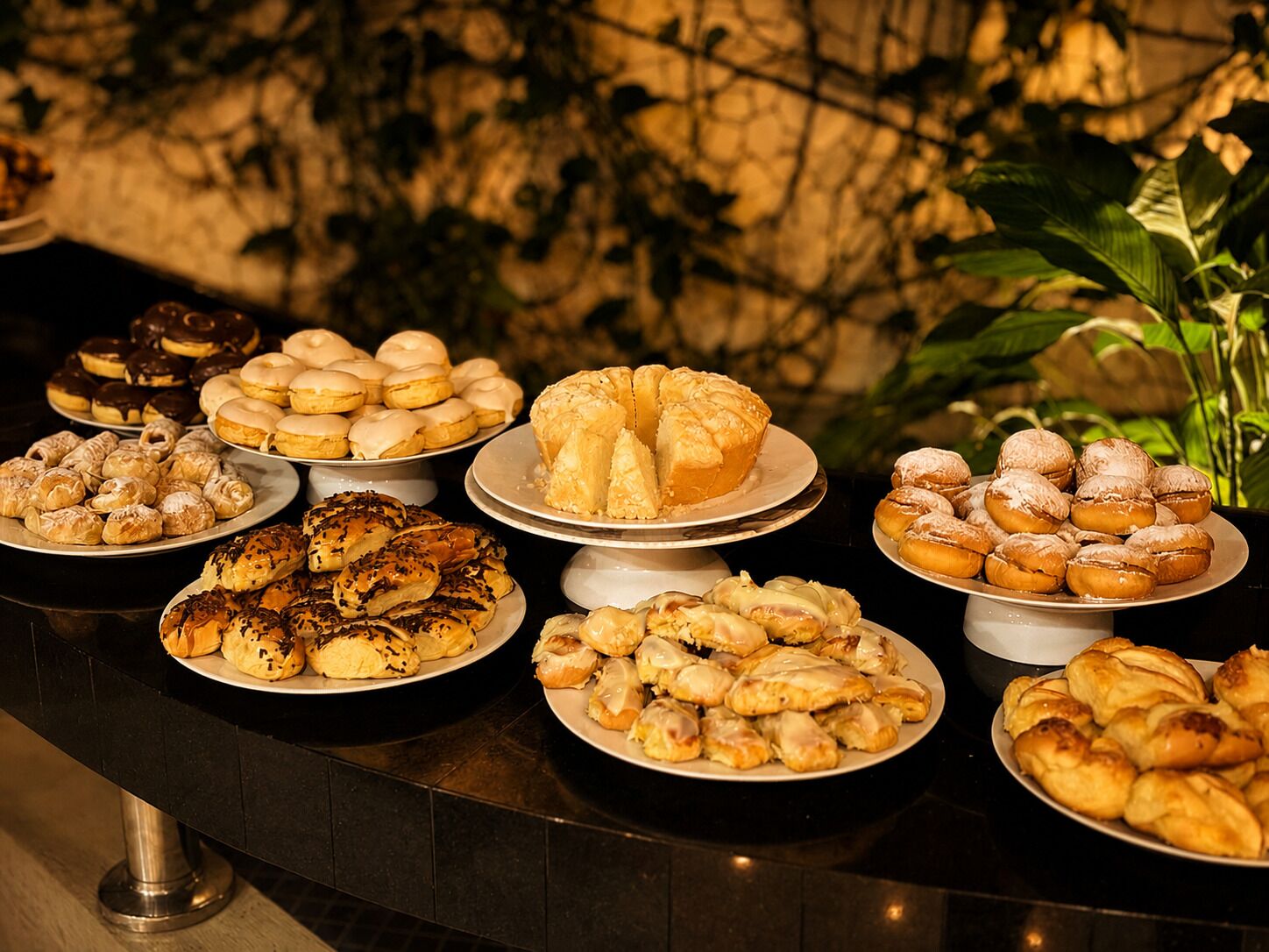 A buffet with various pastries and desserts.