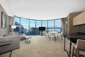 Suite, 1 King Bed with Sofa bed | Living area | 49-inch TV with cable channels