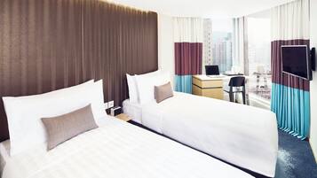 Superior Twin Room | Minibar, in-room safe, desk, laptop workspace