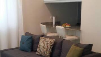 Room, 1 Queen Bed | Living room | 50-inch flat-screen TV with cable channels, TV, DVD player