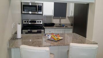 Room, 1 Queen Bed | Private kitchen | Full-sized fridge, microwave, oven, stovetop
