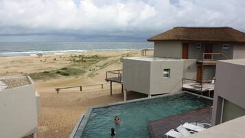 Outdoor pool, pool umbrellas, sun loungers