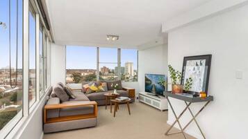 Apartment, 3 Bedrooms | Living area | Flat-screen TV, DVD player