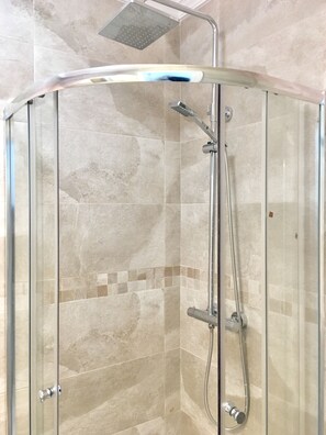 Shower, hair dryer, towels, soap