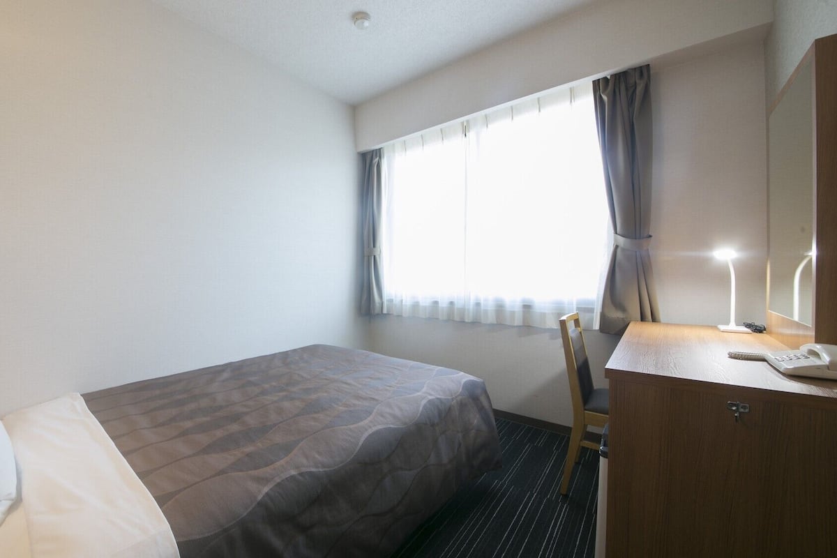 Desk, blackout drapes, iron/ironing board, rollaway beds
