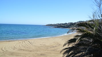 On the beach, sun-loungers, beach towels