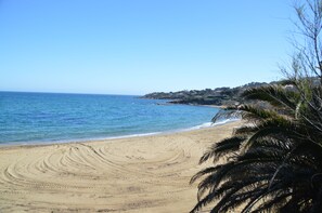 On the beach, sun-loungers, beach towels