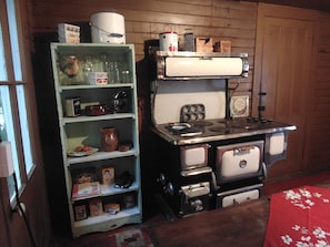Classic kitchen with a range, oven, and wooden cabinetry.