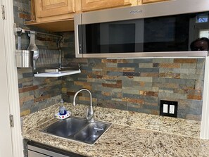 Fridge, microwave, stovetop, coffee/tea maker
