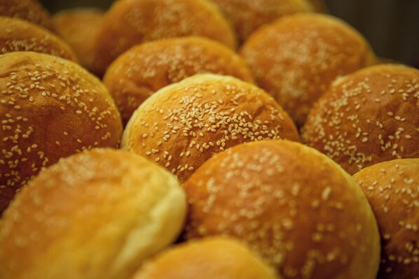 A close-up of round, sesame-seed-topped buns. - Victory Road Villas (Phong Nha)