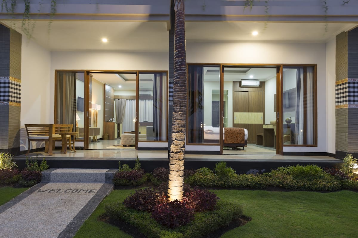 suite, 1 king bed, ocean view | front of property – evening/night