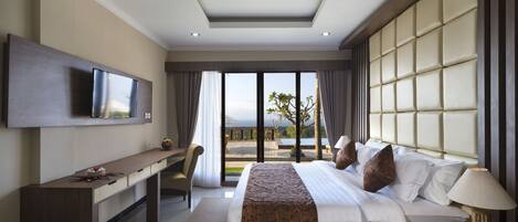 A modern hotel room with a large bed, a desk, a television, and a view of the outdoors.