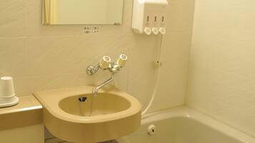 Combined shower/tub, free toiletries, hair dryer, slippers